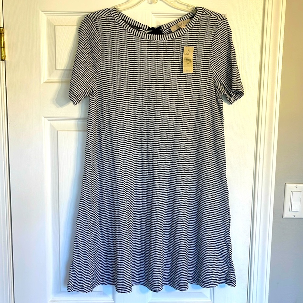 Never worn!! Loft A-line black and white dress with black tie at back of neck